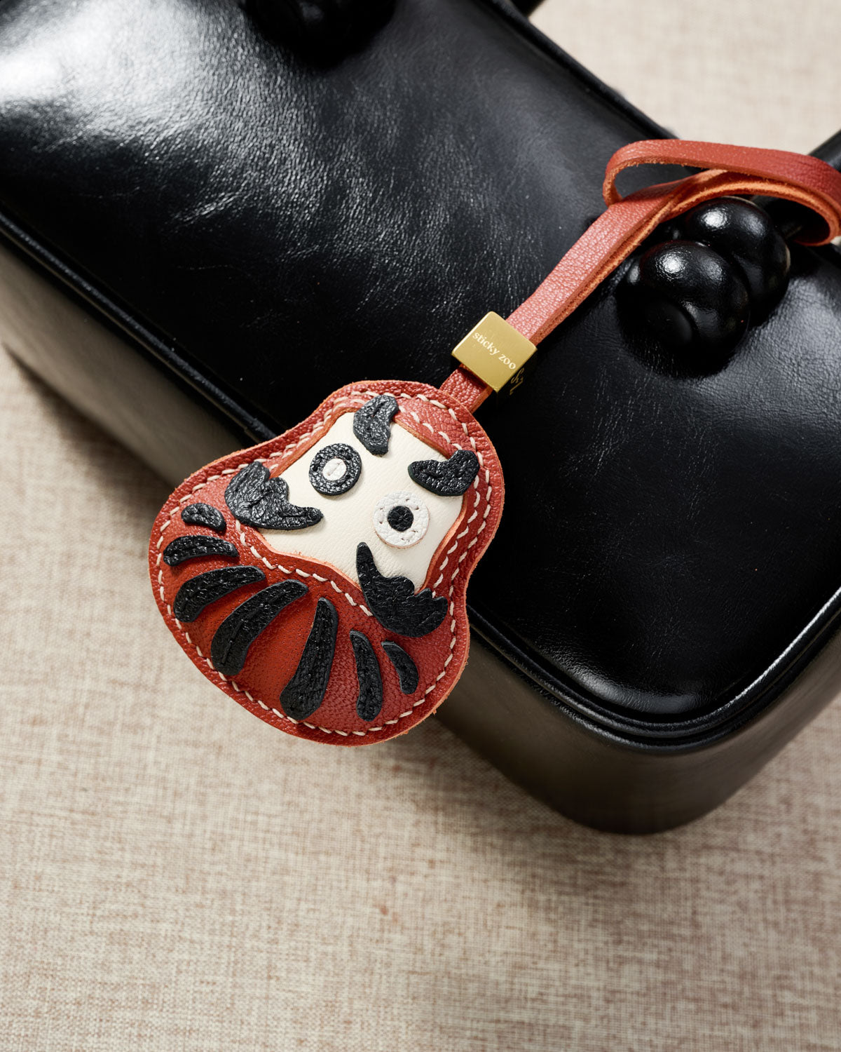 DARUMA CHARM