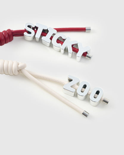 STICKY HEART BOW STACK CHARM